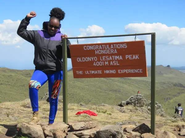 Cypress Bush Explorers co-founder celebrating at the summit of Oldonyo Lesatima Peak, 4,001 m