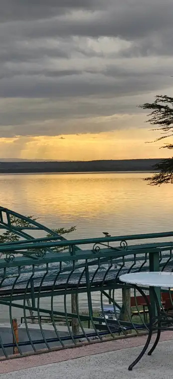 Golden evening light over the lake from the lodge deck